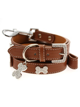 Brown Leather Diamante Collar / Diamante Bone Charm & Lead Set - Sparkling Bling Collar and Lead Set. This brown leather collar with a stitched edging has a crystal encrusted buckle with three large / bling sparkling diamante bones and a large sparkling diamante charm complete the look. A glamorous addition to the wardrobe of any trendy pooch. Matching lead has s...
